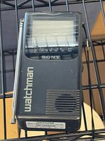 Front view showing screen, logo, antenna, speaker grille