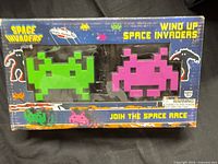 Front of boxed set showing green and pink figures