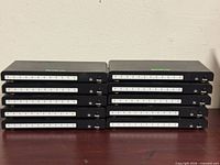 Front view showing LED indicators and power buttons on ten stacked splitters
