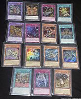 All sixteen sleeved Yu-Gi-Oh cards laid out
