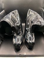 front top view of both boots showing patent finish and wear