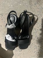 Top view of both sandals showing straps, toe shape and material