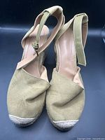 Top view showing olive suede uppers, closed toes, ankle straps
