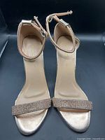 Top view showing insole branding, ankle strap, toe strap rhinestones