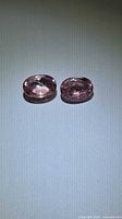 Both oval cabochon spinels top view