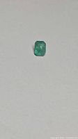 Front view of octagon-cut emerald showing color and shape