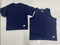 T-shirt and tank displayed side by side showing style and color
