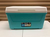 Front view of teal Igloo 48-quart cooler showing brand logo and capacity label