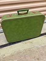 front view of green suitcase
