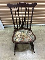 Front view showing spindle back and tapestry seat