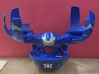 Front view of Bakugan DEKA Aquos Fear Ripper opened, showing face, arms and 400 G-Power marking