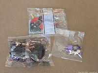 Three sealed Lego parts bags overview