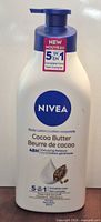 Front view of Nivea Cocoa Butter 5-in-1 Body Lotion bottle