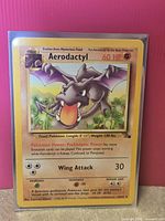 Front of Aerodactyl card in protective sleeve