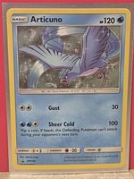 Front of Articuno SM144 Cosmos holo card showing artwork, stats, holo pattern