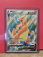 Front of Charizard V card in rigid toploader