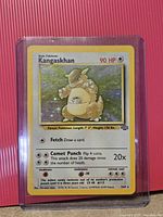 Front of Kangaskhan 5/64 card in sleeve