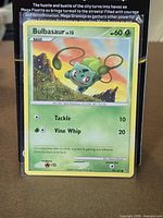 Front of Bulbasaur card in protective sleeve