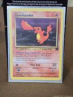Front of Dark Charmander card showing artwork, text, HP, attack, set symbol