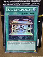 Front view of Gold Sarcophagus card showing title, artwork and Limited Edition text