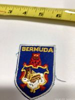 Front view of embroidered Bermuda patch with tape measure showing size