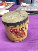 Front of tin showing Brier logo, price, lid condition