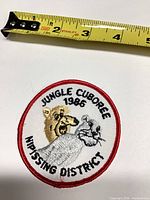 Front view with tape measure shows embroidered patch