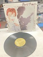 Front sleeve with portrait artwork and Bowie name