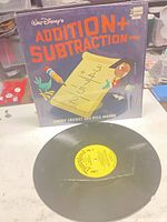 Front cover and vinyl showing sleeve artwork and record label