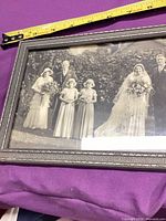 overall view showing framed wedding portrait with measuring tape