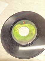 Side A label showing track "Give Me Love (Give Me Peace on Earth)"
