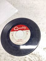 A-side label East West showing Quality Records branding and surface wear