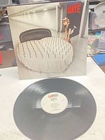 Front of jacket and vinyl record showing label and condition