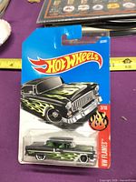 Front of sealed Hot Wheels '55 Chevy showing graphics and car