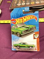 Front view of carded Hot Wheels Barracuda showing car and branding