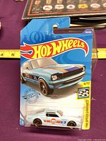 Front of sealed Hot Wheels ’65 Mustang 2+2 Fastback card showing car and graphics