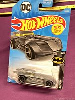 Front of blister-carded Hot Wheels Batmobile showing car and branding