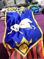 Entire banner laid out showing horse, crest, striped bottom