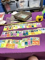 Wide view of spread showing quantity and variety of Pokémon cards