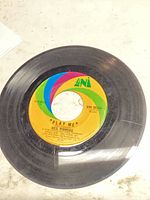 Side A label "Play Me" on UNI 55345, visible scratches on black vinyl