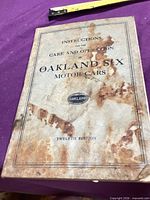 Front cover of Oakland Six instruction manual showing title and condition