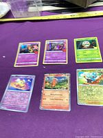 All six Pokémon Sword & Shield era cards laid out on purple surface