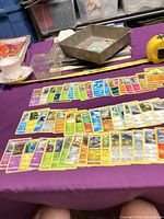 Overview of entire spread of assorted Pokemon cards on table