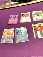 All six cards laid out showing fronts and finishes