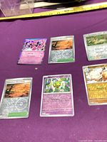 Overview showing Enamorus holo and five additional cards on table