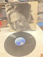 Front of sleeve with vinyl record displayed
