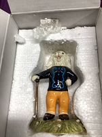 Figurine in styrofoam insert inside box