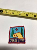 Patch front with tape measure showing size around 2 x 3 inches