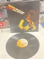 Front cover and vinyl record displayed