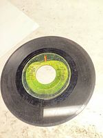 Side showing The Ballad of John and Yoko label with wear